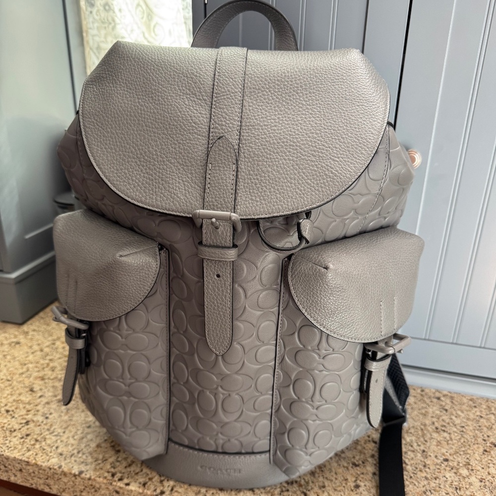 Coach Warner backpack and two piece wallet set.